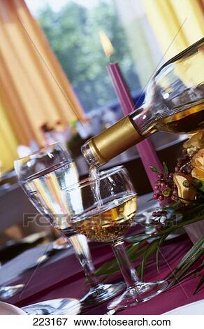 Close-up of wine being poured into wine glass View Large Photo Image Stock Photo - Close-up of wine being poured into wine glass . Fotosearch