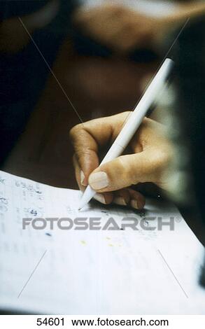 Close-up of woman's hand holding ballpoint pen View Large Photo Image Stock Image - Close-up of woman's hand holding ballpoint pen . Fotosearch