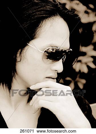 Close-up of young man thinking View Large Photo Image Stock Image - Close-up of young man thinking . Fotosearch