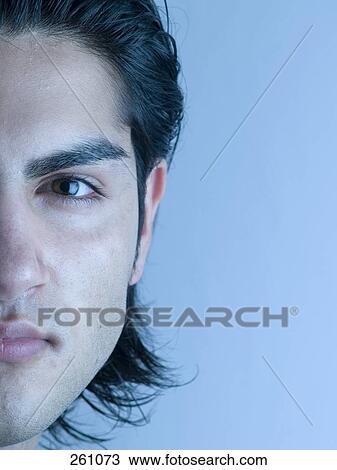 Close-up of young man thinking View Large Photo Image Stock Image - Close-up of young man thinking . Fotosearch