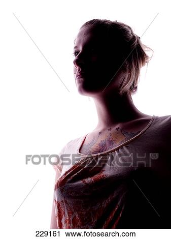Close-up of young woman looking serious View Large Photo Image Stock Image - Close-up of young woman looking serious . Fotosearch