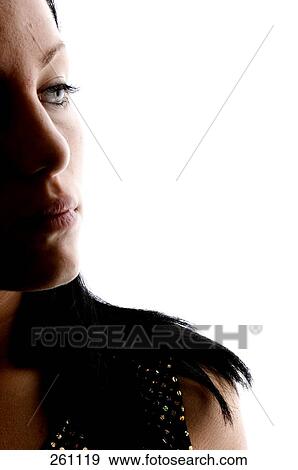Close-up of young woman looking serious View Large Photo Image Stock Photo - Close-up of young woman looking serious . Fotosearch