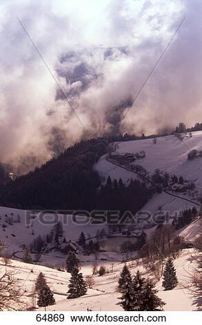 Clouds over snowy mountains View Large Photo Image Stock Photo - Clouds over snowy mountains . Fotosearch