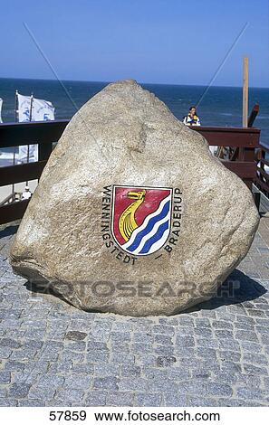 Stock Photo - Coat of arms on rock at coast, Wenningstedt-Braderup, Sylt, Nordfriesland, Schleswig-Holstein, Germany . Fotosearch