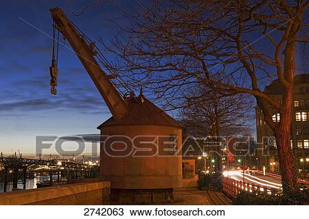 Crane on riverside at dusk, Hamburg, Germany View Large Photo Image Stock Image - Crane on riverside at dusk, Hamburg, Germany . Fotosearch