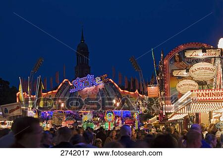 Fairground lit up at night, Hamburg, Germany View Large Photo Image Stock Photo - Fairground lit up at night, Hamburg, Germany . Fotosearch