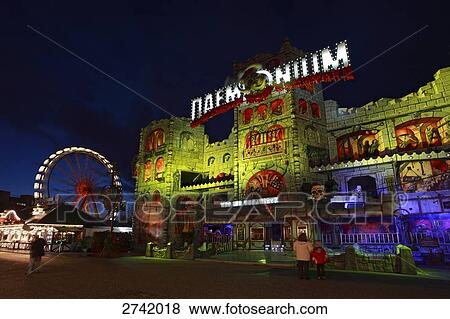 Fairground lit up at night, Hamburg, Germany View Large Photo Image Stock Photo - Fairground lit up at night, Hamburg, Germany . Fotosearch