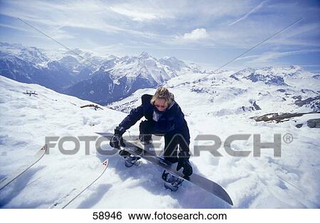 Stock Photograph - Female snowboarder in snow . Fotosearch