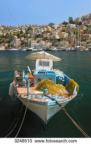 Fishing boat in the port of Symi, Greece View Large Photo Image Stock Image - Fishing boat in the port of Symi, Greece . Fotosearch