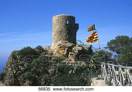 Flags near old ruins of a tower View Large Photo Image Stock Photography - Flags near old ruins of a tower . Fotosearch