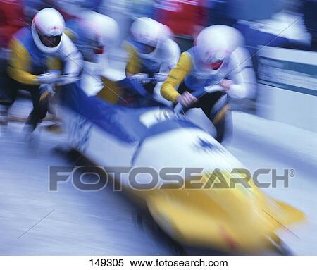 Stock Photography - Four people with bobsleigh, blurred . Fotosearch