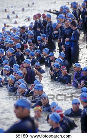 Group of men in water in a triathlon event View Large Photo Image Stock Image - Group of men in water in a triathlon event . Fotosearch