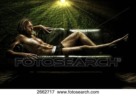 Halfnaked man lying on sofa View Large Photo Image Stock Photo - Halfnaked man lying on sofa . Fotosearch