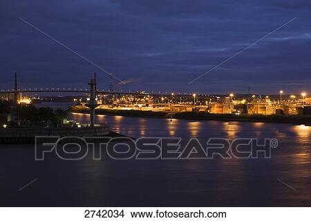 Picture - Harbor lit up at night, Koehlbrand Bridge, Hamburg, Germany . Fotosearch