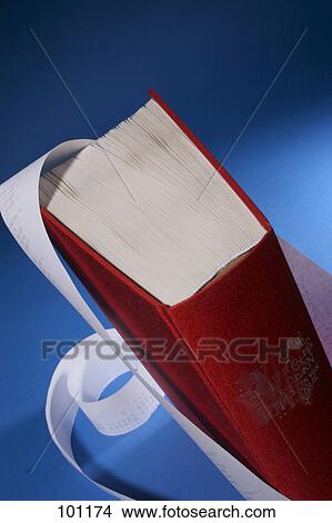 High angle view of book and adding machine tape View Large Photo Image Picture - High angle view of book and adding machine tape . Fotosearch