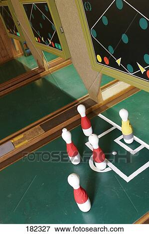 Stock Photo - High angle view of bowling pins at bowling alley . Fotosearch
