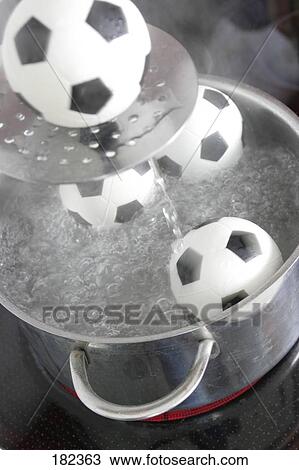 Stock Image - High angle view of soccer ball in water . Fotosearch