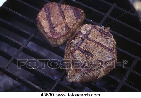 High angle view of steaks on a barbeque grill, Yukon, Alaska, Canada, USA View Large Photo Image Stock Image - High angle view of steaks on a barbeque grill, Yukon, Alaska, Canada, USA . Fotosearch