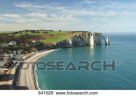 Stock Photo - High angle view of town on coast, Etretat, Seine-Maritime, Haute-Normandy, France . Fotosearch