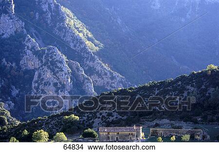 Picture - House near mountain, Provence-Alpes-Cote d'Azur, France . Fotosearch
