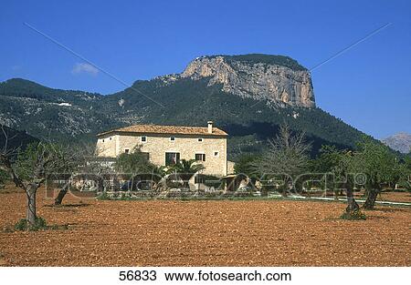 Stock Image - House on a rural landscape . Fotosearch
