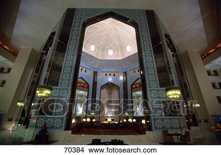 Interiors of lit up hotel, Al Bustan Palace Hotel, Muscat View Large Photo Image Picture - Interiors of lit up hotel, Al Bustan Palace Hotel, Muscat . Fotosearch