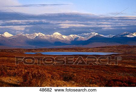 Lake with mountain range in background, Denali Highway, Alaska Range, Alaska, USA View Large Photo Image Stock Image - Lake with mountain range in background, Denali Highway, Alaska Range, Alaska, USA . Fotosearch