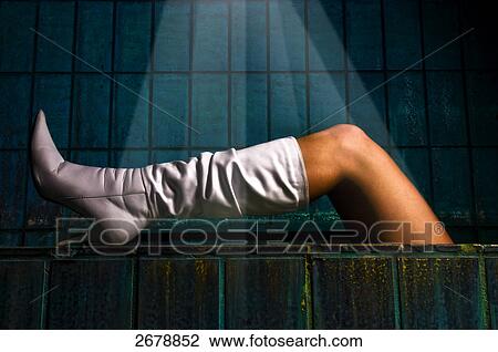 legs of a woman wearing boots View Large Photo Image Stock Image - legs of a woman wearing boots . Fotosearch