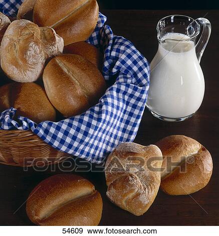 Stock Photo - Loaves of breads in basket . Fotosearch