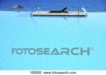 Lounge chair at poolside View Large Photo Image Stock Image - Lounge chair at poolside . Fotosearch