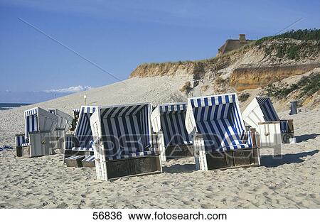 Stock Photograph - Lounge chairs on the beach . Fotosearch