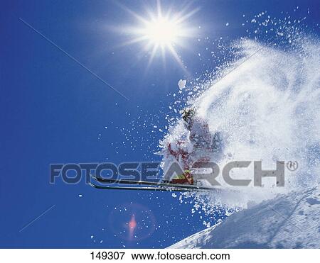 Stock Photo - Low angle view of person skiing . Fotosearch