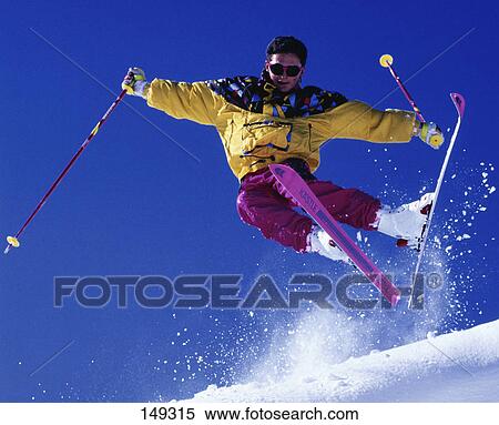Low angle view of young man skiing View Large Photo Image Stock Photography - Low angle view of young man skiing . Fotosearch