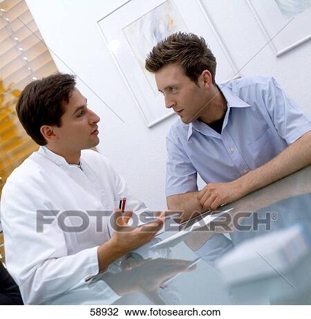 Stock Image - Male doctor advising man . Fotosearch