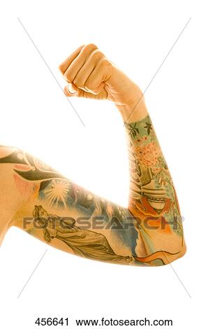 Stock Image - Man flexing his tattooed muscles . Fotosearch