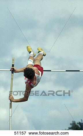Man pole vaulting View Large Photo Image Stock Photo - Man pole vaulting . Fotosearch