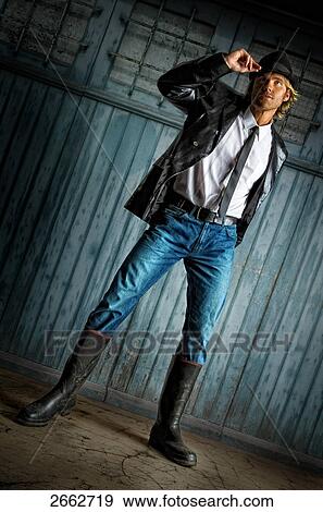Stock Photo - Mid adult man posing . Fotosearch