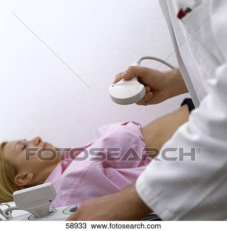 Mid section view of doctor examining patient View Large Photo Image Stock Image - Mid section view of doctor examining patient . Fotosearch