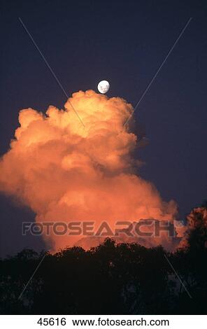 Stock Photograph - Moon meets cloud in sky, Australia . Fotosearch