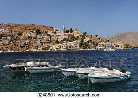 Motorboats in the port of Symi, Greece View Large Photo Image Stock Image - Motorboats in the port of Symi, Greece . Fotosearch