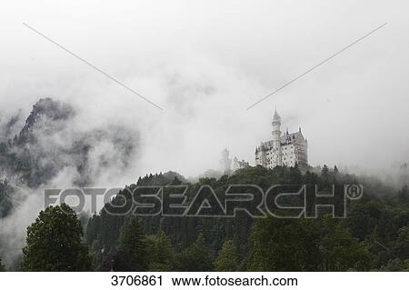 Stock Image - Neuschwanstein Castle in fog, Bavaria, Germany . Fotosearch