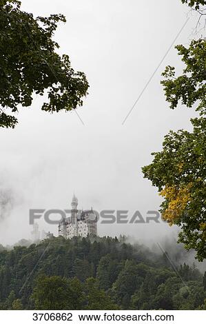 Stock Image - Neuschwanstein Castle in fog, Bavaria, Germany . Fotosearch