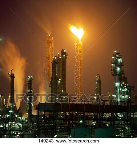 Oil refinery lit up at night View Large Photo Image Stock Image - Oil refinery lit up at night . Fotosearch