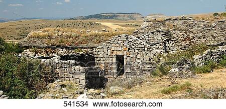 Old ruins on volcanic landscape, Causse Mejean, Auvergne, France View Large Photo Image Picture - Old ruins on volcanic landscape, Causse Mejean, Auvergne, France . Fotosearch