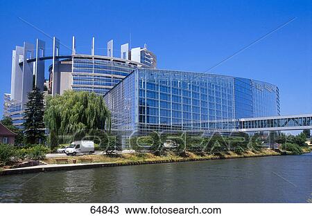 Stock Image - Parliament building at waterfront, Louise Weiss Building, Strasbourg, Alsace, France . Fotosearch