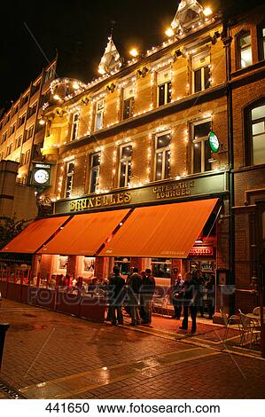 People at bar lit up at night, Dublin, Republic of Ireland View Large Photo Image Stock Image - People at bar lit up at night, Dublin, Republic of Ireland . Fotosearch