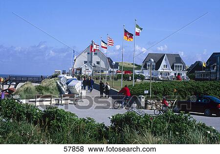 Stock Photo - People on a bridge leading to a coast . Fotosearch
