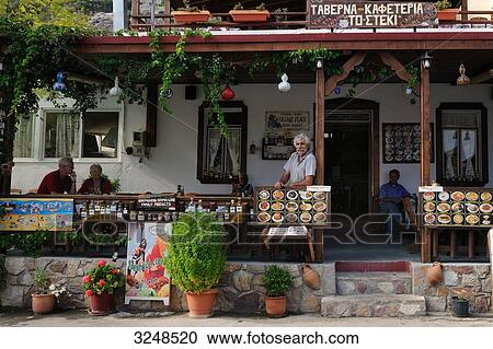 People on the veranda of a cafeteria, Rhodes, Greece View Large Photo Image Stock Image - People on the veranda of a cafeteria, Rhodes, Greece . Fotosearch