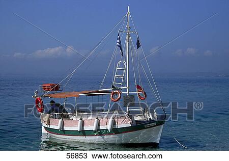 Person in a fishing boat in the sea View Large Photo Image Stock Image - Person in a fishing boat in the sea . Fotosearch