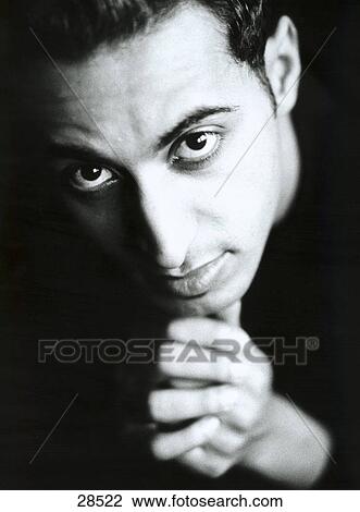Portrait of a young man posing View Large Photo Image Stock Image - Portrait of a young man posing . Fotosearch